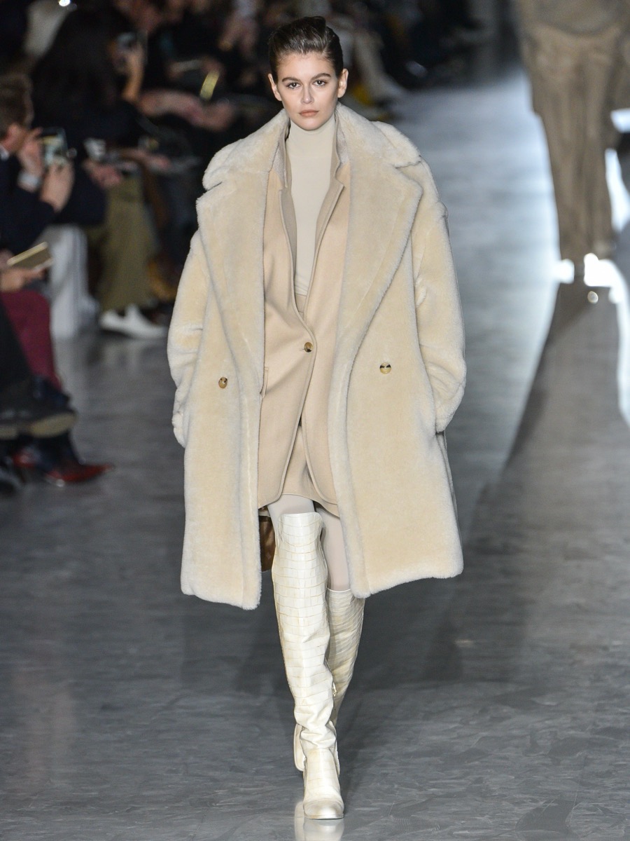 Kaia Gerber walking the Max Mara Fall/Winter 2019 runway in a cream teddy coat, Milan Fashion Week